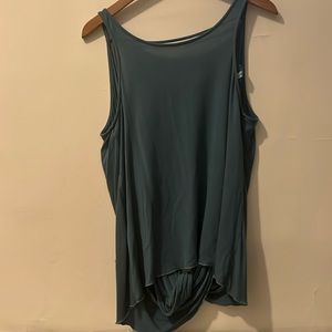 Open back top. Never worn. Missing original selling tag.